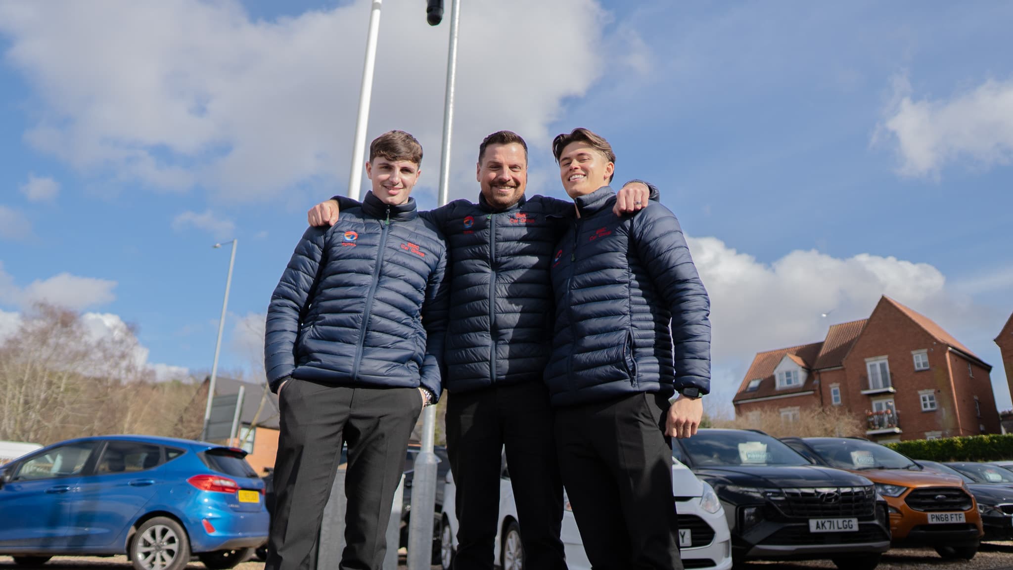 Three members of the BMC Group team on the forecourt